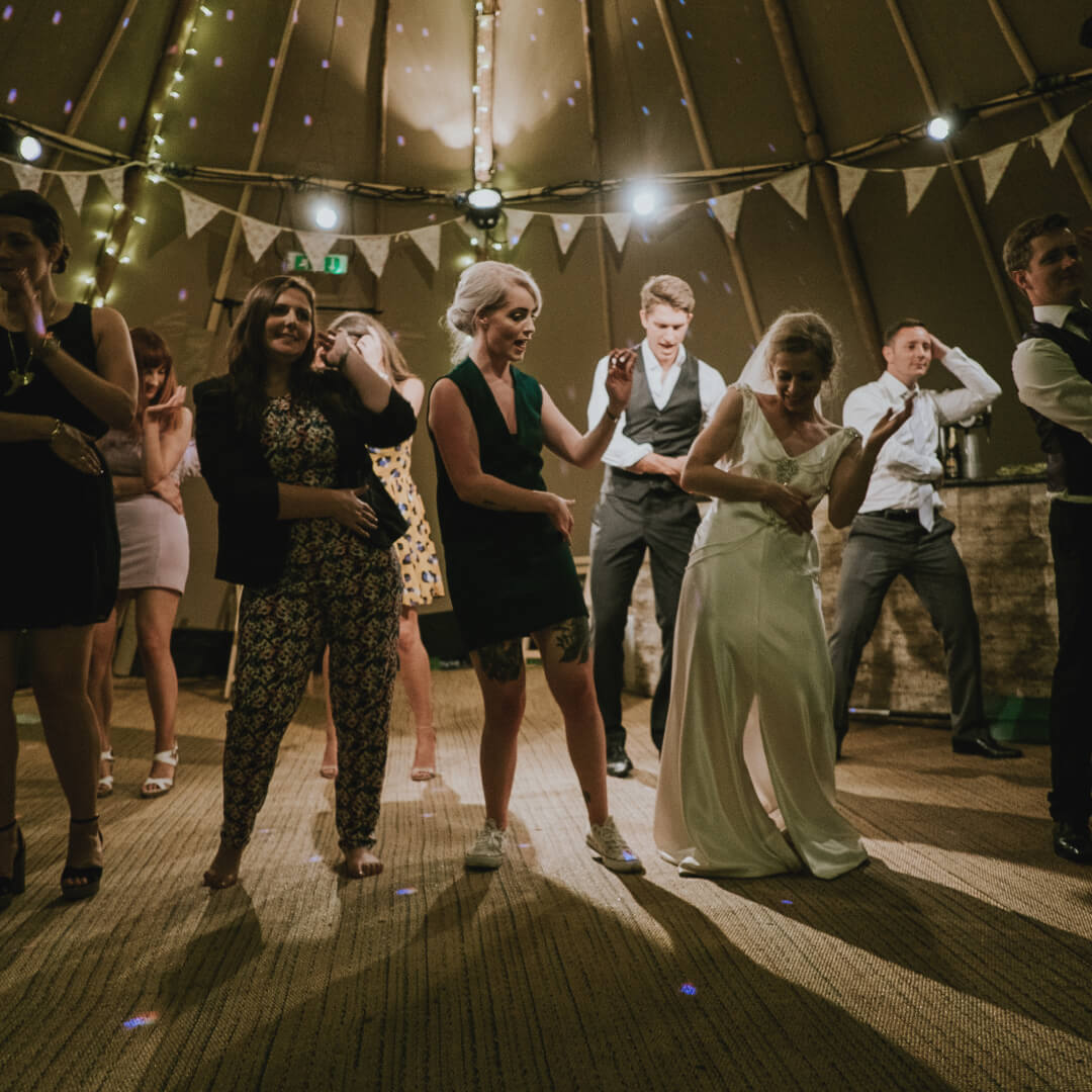 People dancing in the night at a wedding