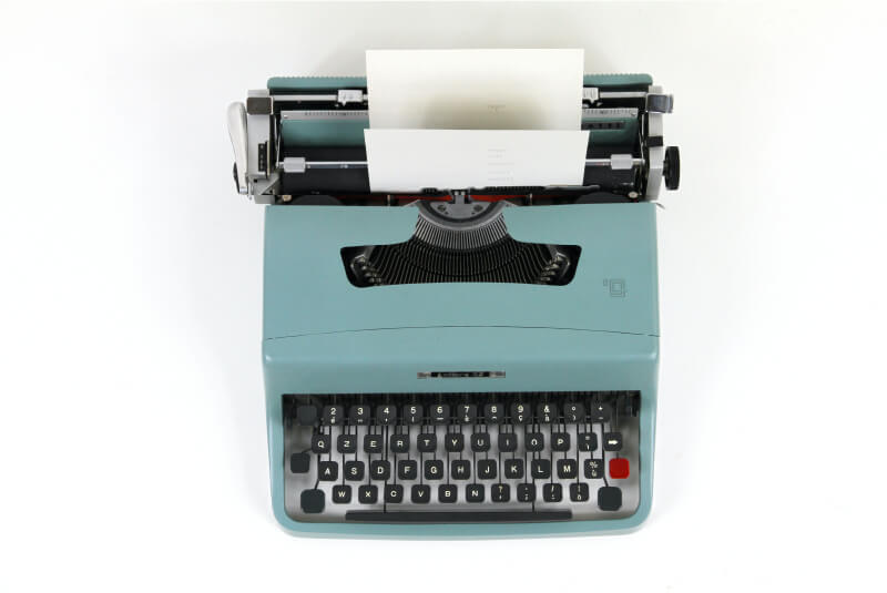 Image of a powdered blue typewriter